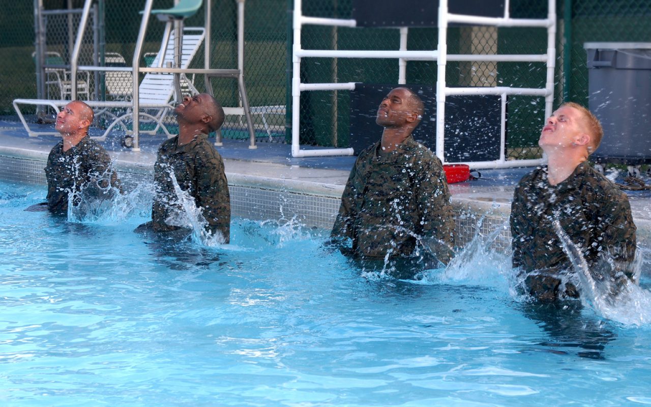 GUANTANAMO BAY, Cuba  Marine Combat Instructor of Water Survival, Staff Sgt. Bruce Henning instructs Marines of Fox Company, 2nd Battalion, 9th Marines during water survival skill training for their annual swim qualification at Windjammer pool, U.S. Naval Station Guantanamo Bay, Cuba, Nov. 9, 2009. The Marines with Fox Co are conducting training in GTMO until the arrival of USS Wasp, where they will re-board and continue their mission. JTF Guantanamo conducts safe, humane, legal and transparent care and custody of detainees, including those convicted by military commission and those ordered released by a court. The JTF conducts intelligence collection, analysis and dissemination for the protection of detainees and personnel working in JTF Guantanamo facilities and in support of the War on Terror. JTF Guantanamo provides support to the Office of Military Commissions, to law enforcement and to war crimes investigations. The JTF conducts planning for and, on order, responds to Caribbean mass migration operations. (JTF Guantanamo photo by Army Spc. Cody Black) UNCLASSIFIED  Cleared for public release. For additional information contact JTF Guantanamo PAO 011-5399-3589; DSN 660-3589 www.jtfgtmo.southcom.mil