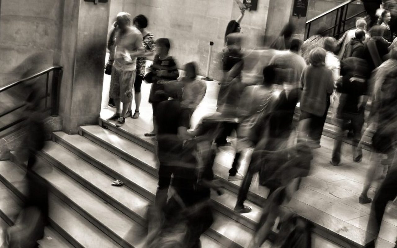 black-and-white-image-of-people-walking-in-underground_1600X1067